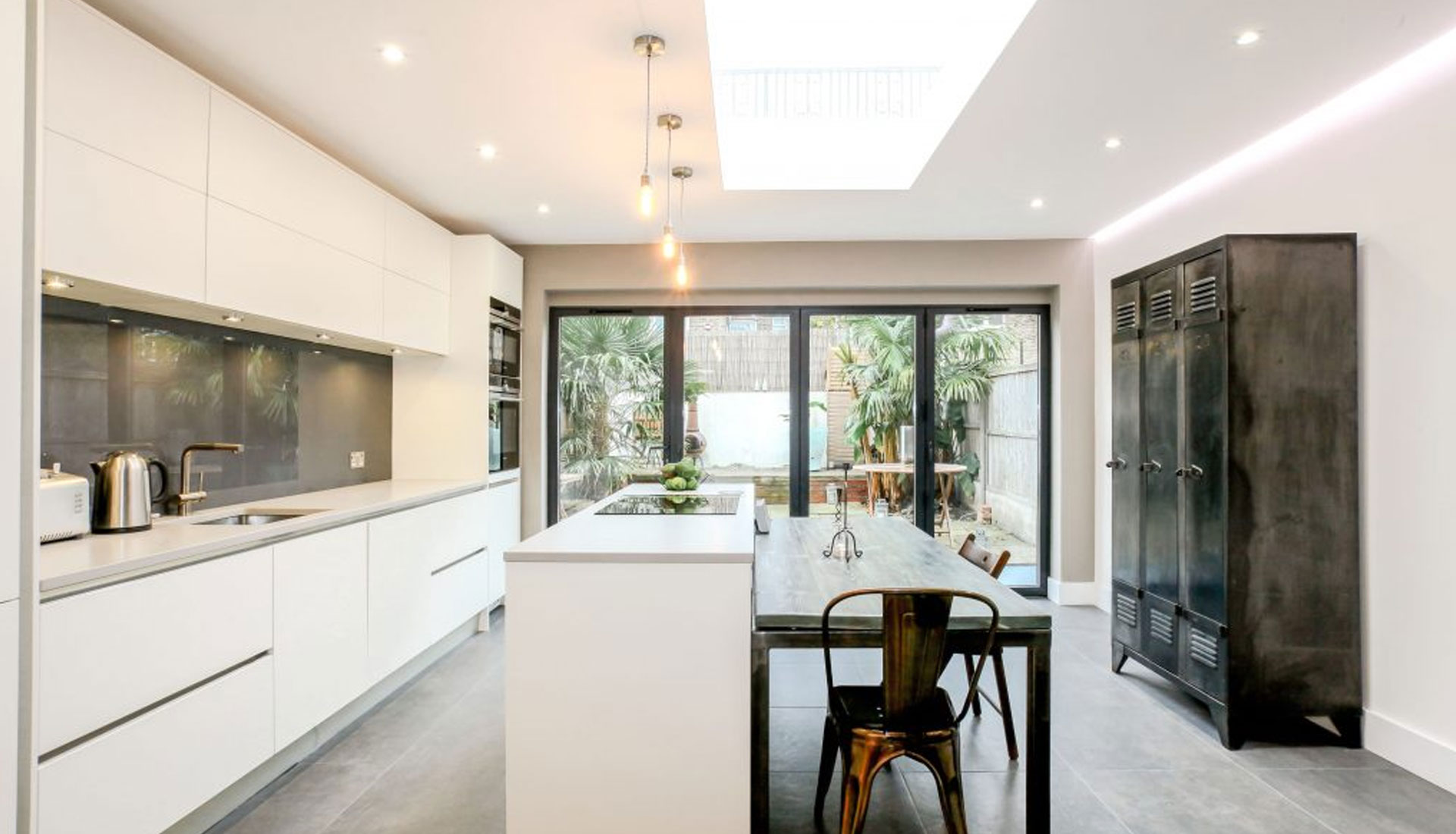 A finished white kitchen by Professional Polish Builders in Croydon & South London