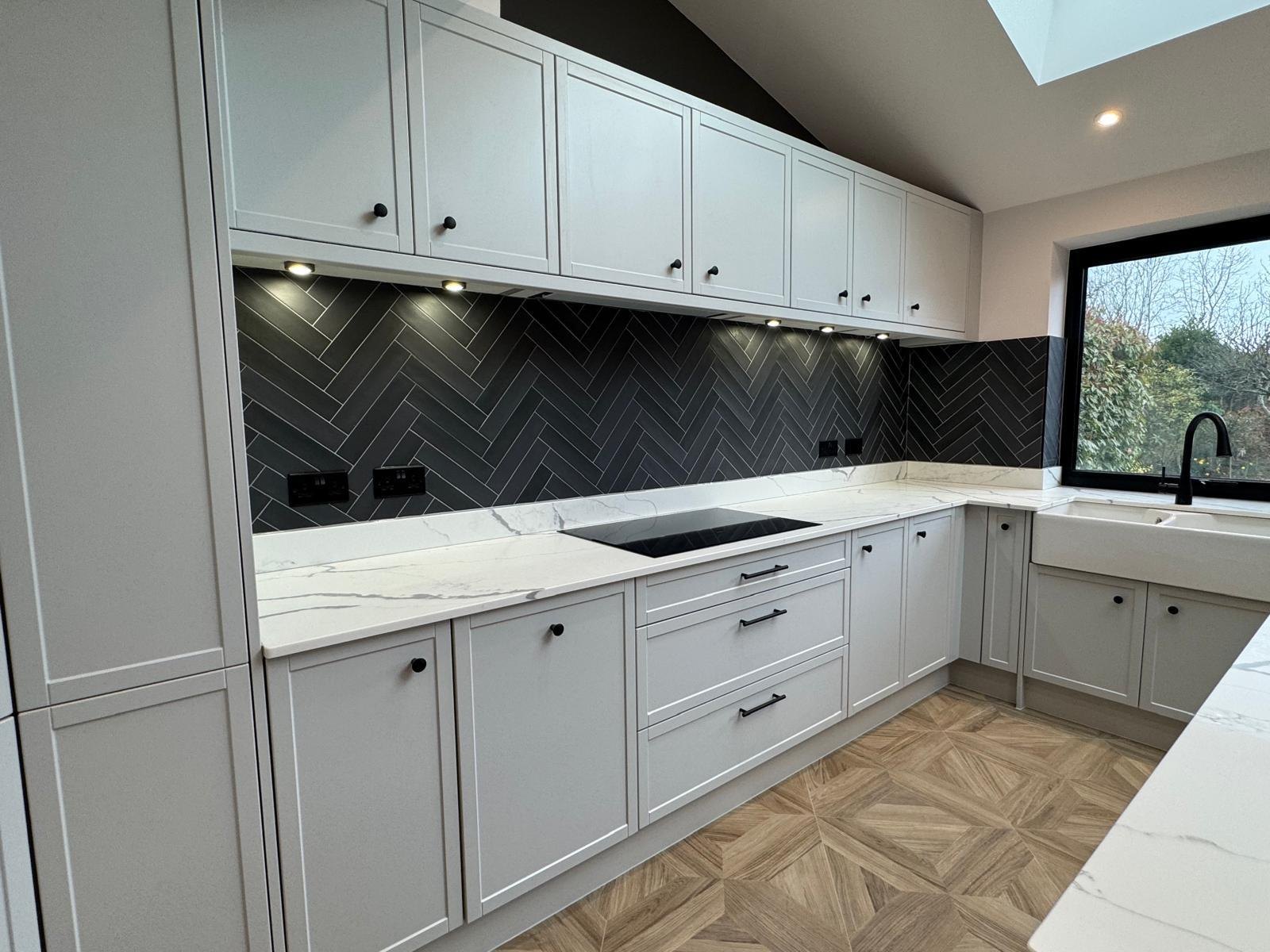 A shaker kitchen with herringbone flooring