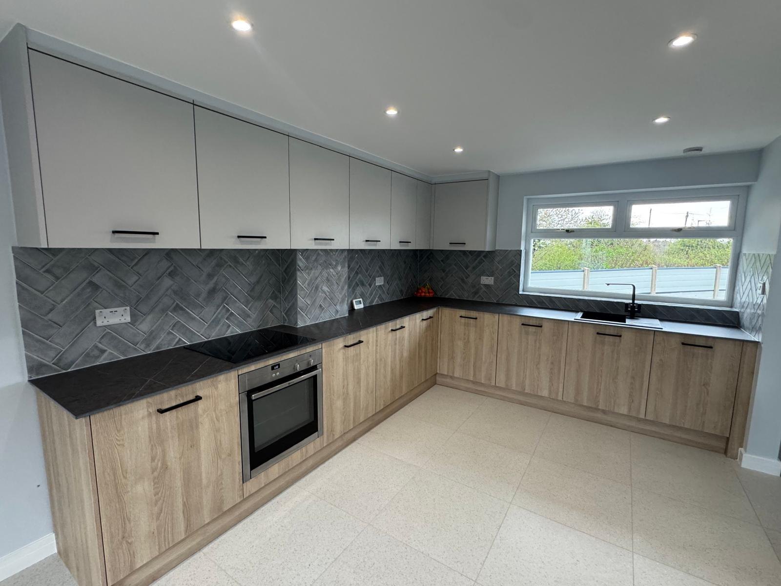 A kitchen combining wood and marble finishes