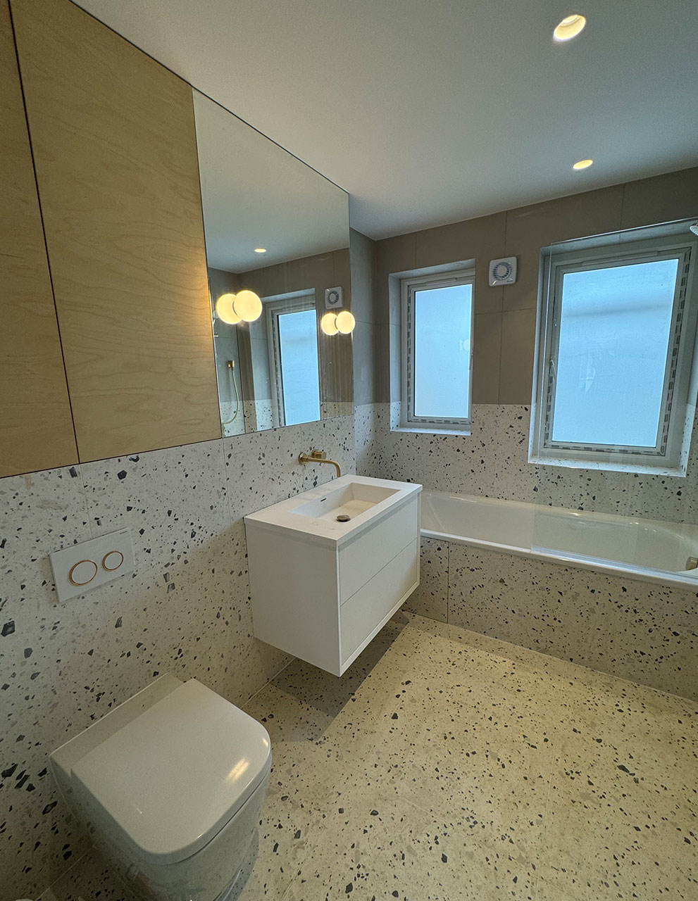 A terrazzo bathroom by Professional Polish Builders in Croydon & South London
