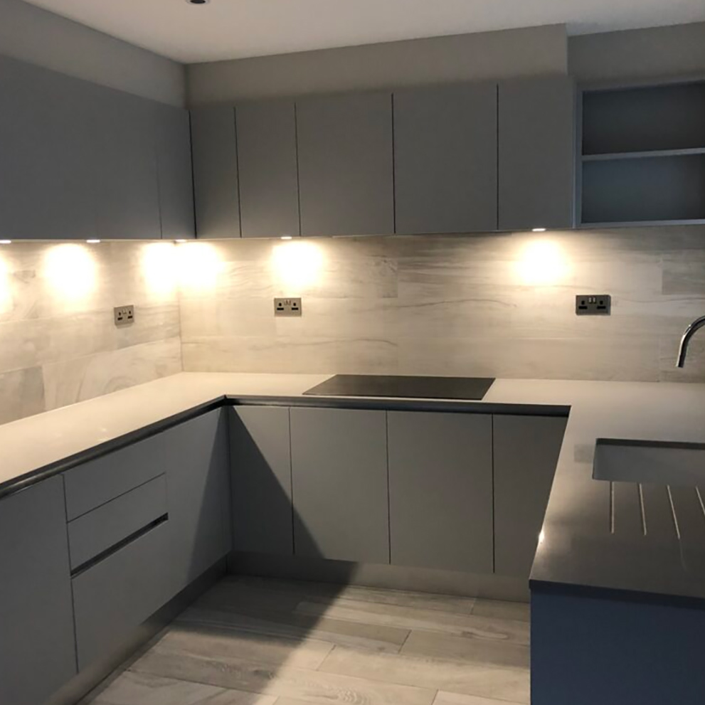 A handleless grey kitchen