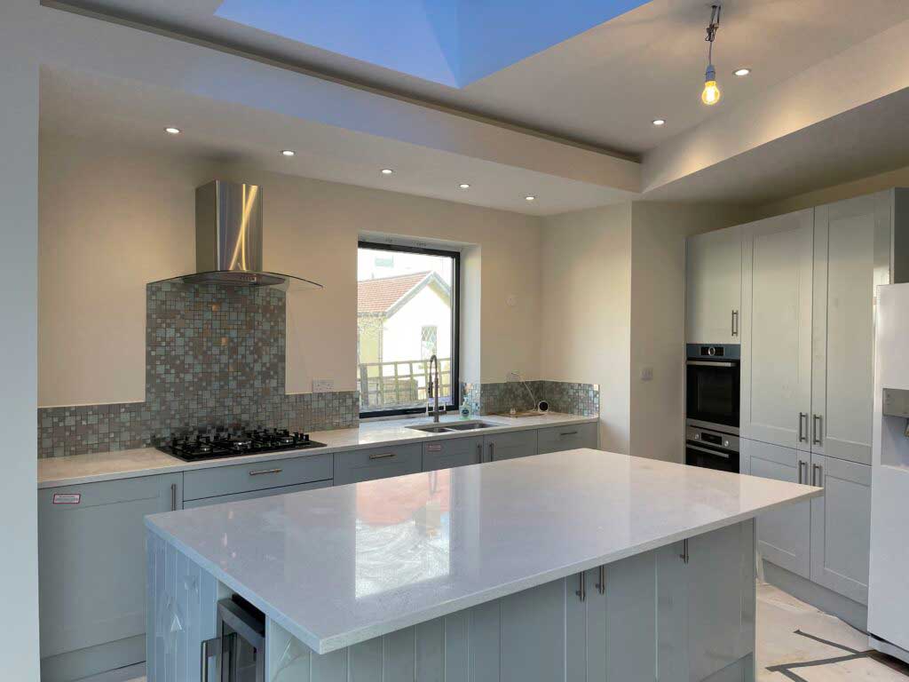 A refurbished kitchen with a central island